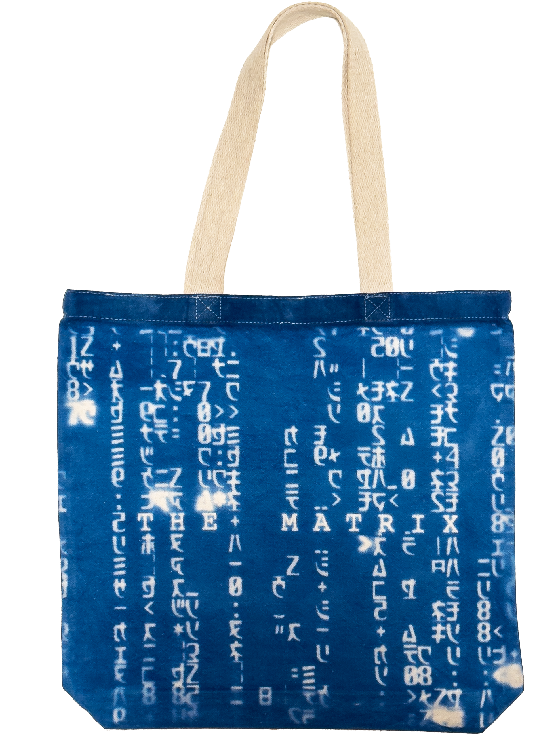 A blue fabric tote bag with white Matrix characters printed vertically across the front, featuring two beige canvas shoulder straps.
